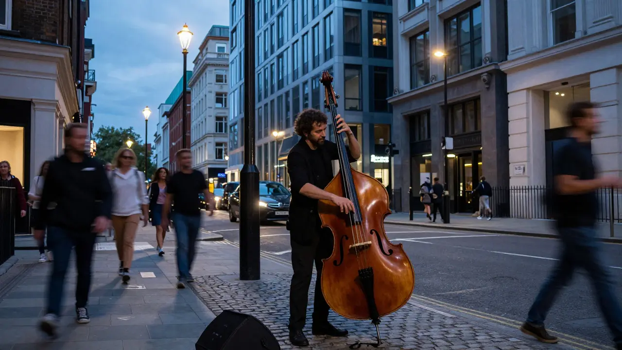 Street musician playing a double bass on a city corner at twilight